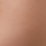 Close-up of a textured brown fabric surface