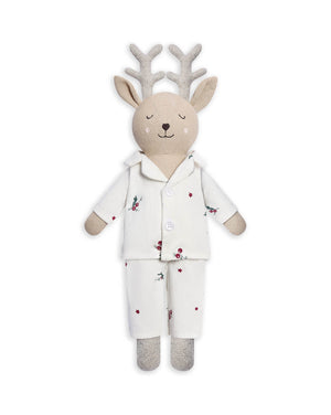 A plush stuffed deer toy wearing a cream pajama set with small red berry and green leaf prints, on a plain white background.