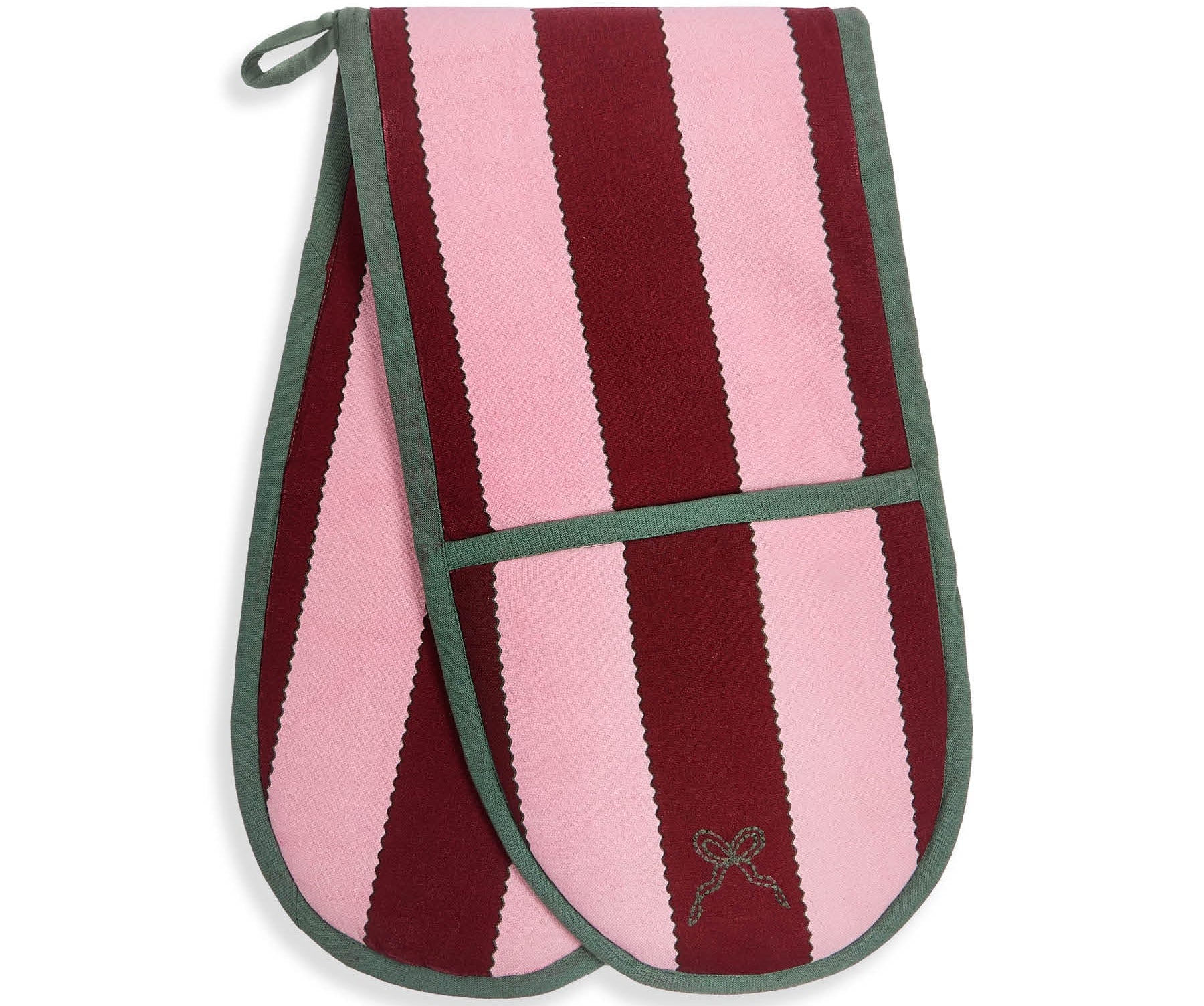 A pair of oven mitts featuring vertical stripes of light pink and deep burgundy, finished with sage green trim and a small embroidered bow on the front pocket.