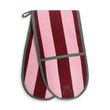 A pair of oven mitts featuring vertical stripes of light pink and deep burgundy, finished with sage green trim and a small embroidered bow on the front pocket.