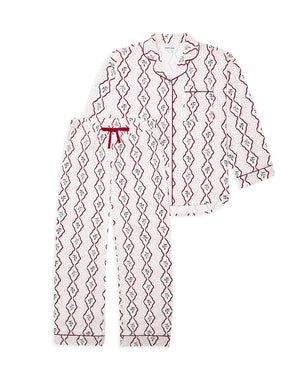 A two-piece pajama set featuring a long-sleeve button-up top and matching pants, both in white with a red and green diamond-patterned print. The top has a red piping border and a red drawstring tie at the collar, while the pants have a matching red piping border and cuffs.