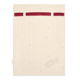 Beige notebook with red accents on a white background