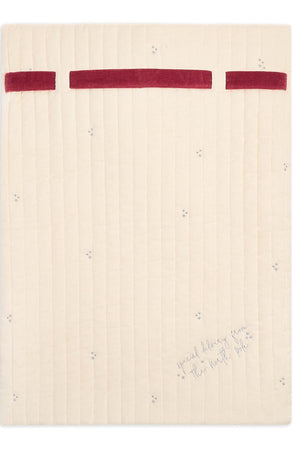 Beige notebook with red accents on a white background