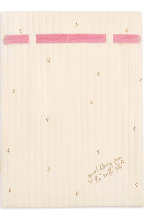 A cream-colored quilted baby blanket with pink elastic bands at the top and small gold embroidered stars, featuring the text 'social learning from the best pet' in gold script near the bottom right.