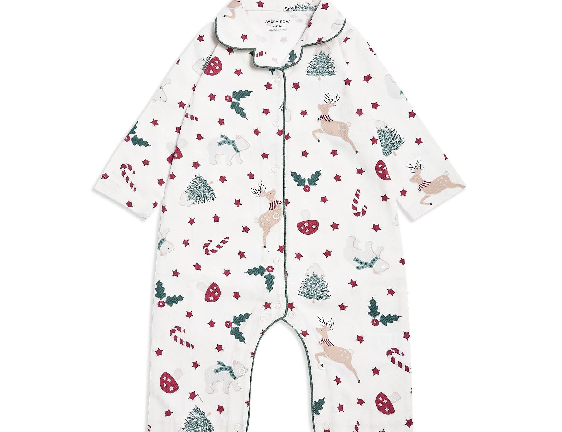 A baby long-sleeve footless romper pajama with a festive Christmas print featuring deer, candy canes, holly, and pine trees on a white background, with green piping trim.