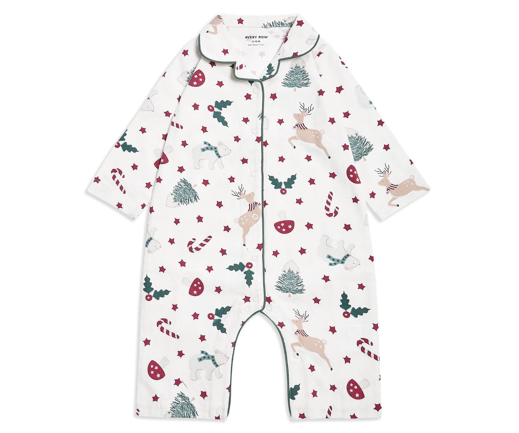 A baby long-sleeve footless romper pajama with a festive Christmas print featuring deer, candy canes, holly, and pine trees on a white background, with green piping trim.