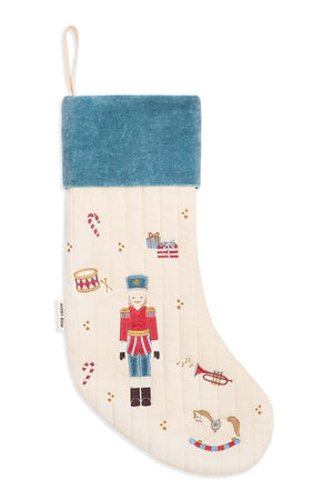 Decorative Christmas stocking with a blue top and festive designs on a white background