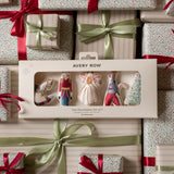 Avery Row Two Decorations Set of 5 in its original window box packaging, surrounded by wrapped Christmas gifts with red ribbons and green satin bows.