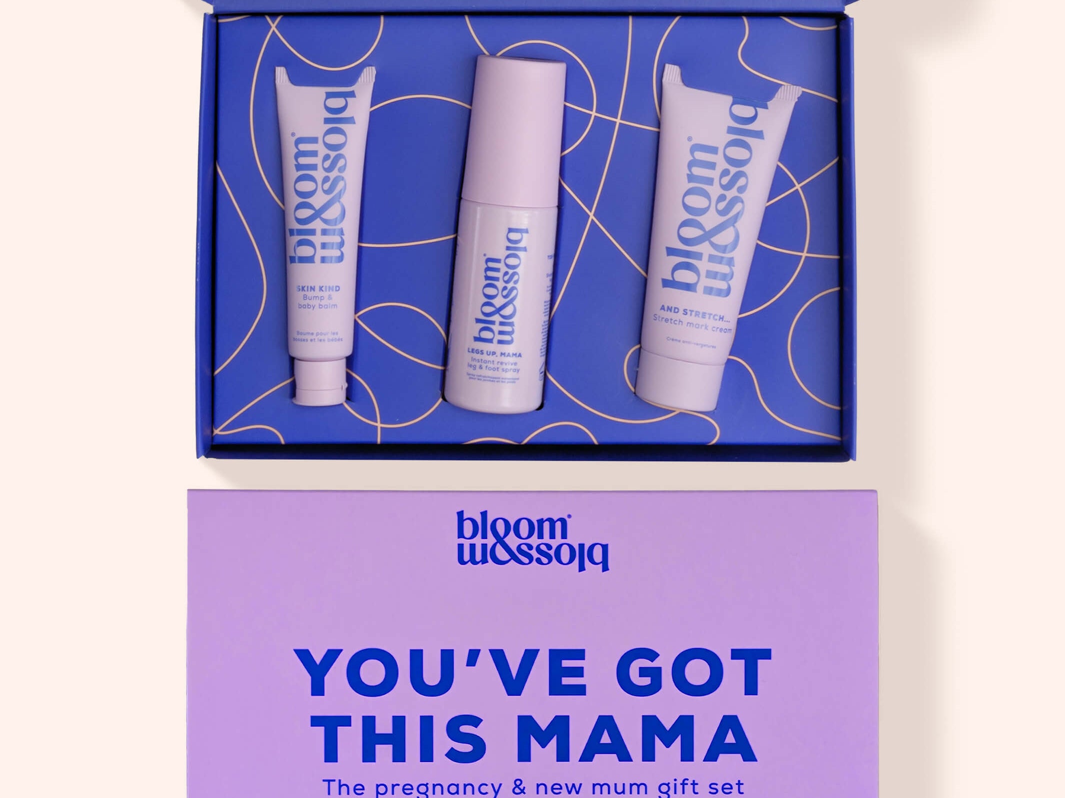 Bloom Blossom 'You've Got This Mama' pregnancy and new mum gift set, featuring an open blue box with three white and lavender skincare tubes, and a matching lavender gift card below on a light beige background.