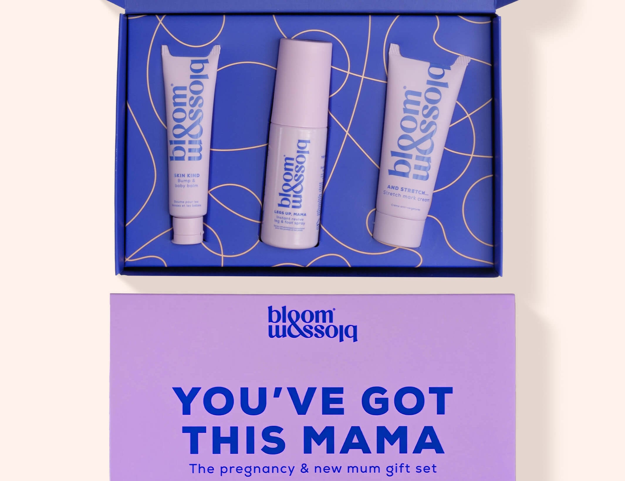 Bloom Blossom 'You've Got This Mama' pregnancy and new mum gift set, featuring an open blue box with three white and lavender skincare tubes, and a matching lavender gift card below on a light beige background.