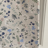 Floral patterned paper with 'Ralphie Bear' branding on a white background