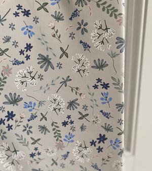 Floral patterned paper with 'Ralphie Bear' branding on a white background
