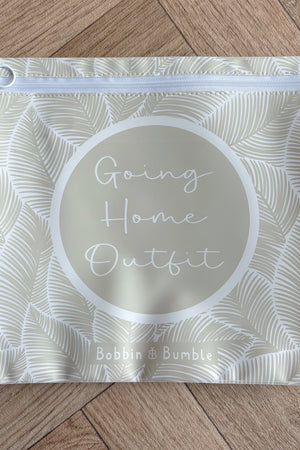 Hospital bag organiser pouches, beige leaf, flat pouch labelled Going Home Outfit on a wooden floor