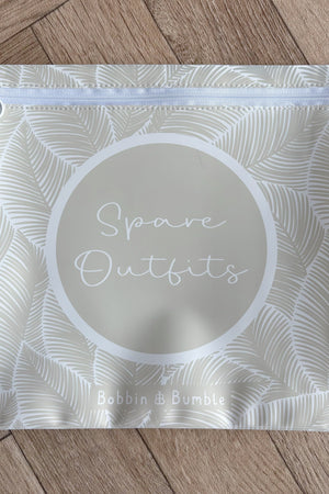Hospital bag organiser pouches, beige leaf, flat pouch labelled Spare Outfits on a wooden floor