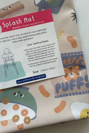 Splash Mat Snack Time packaging label close-up: wipeable, multi-use, care instructions, size 110cm x 110cm