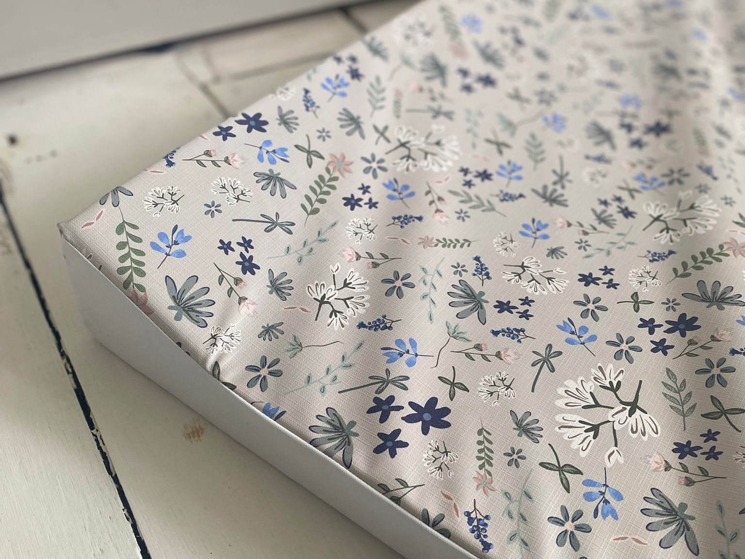 Floral patterned paper with 'Ralphie Bear' branding on a white background