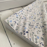 Floral patterned paper with 'Ralphie Bear' branding on a white background