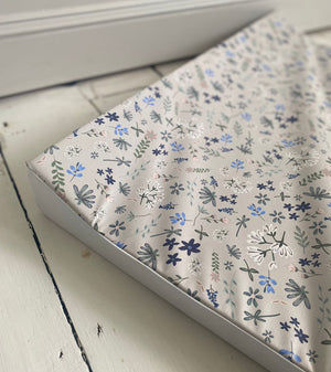Floral patterned paper with 'Ralphie Bear' branding on a white background
