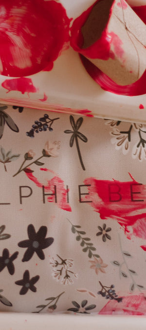 Floral-patterned product with 'RALPHIE BEAR' branding on a matching tray.