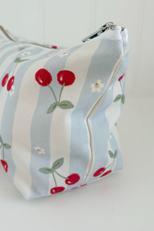 Nappy Wallet Cherry Stripe, side view showing the cherry print on the stripes and the zip end at the top