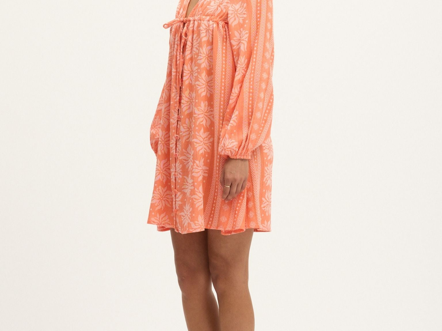 The Deborah Waffle Mini Dress in Camelia by Summery Copenhagen delivers vibrant energy and bump-friendly comfort in one swingy, breathable package.