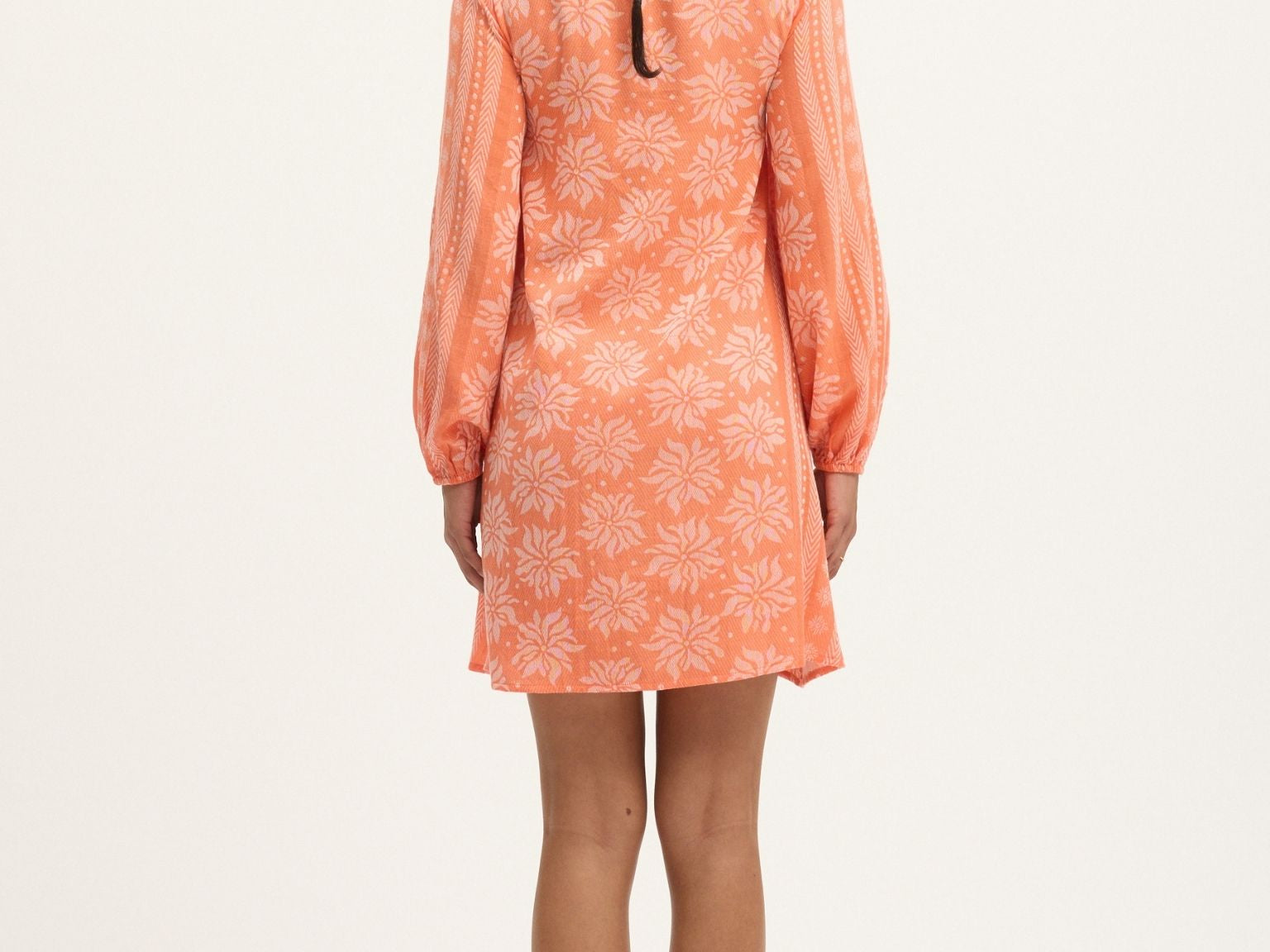 The Deborah Waffle Mini Dress in Camelia by Summery Copenhagen delivers vibrant energy and bump-friendly comfort in one swingy, breathable package.