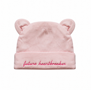 Pink beanie with bear ears and 'future heartbreaker' text on a white background