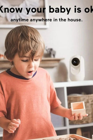 Child holding a small box with a security camera in the background, text 'Know your baby is ok anytime anywhere in the house'.