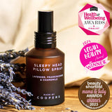 Sleepy Head Pillow Spray beside dried lavender, with Health and Wellbeing, Vegan Beauty and Beauty Shortlist award badges