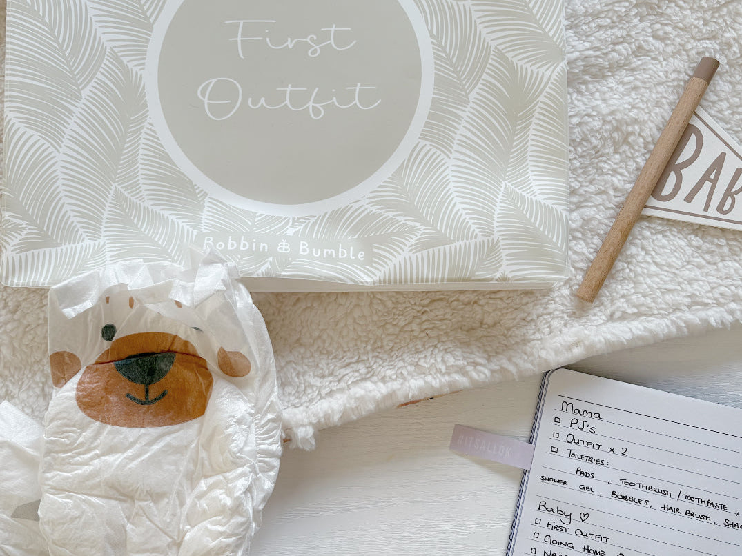 Hospital bag organiser pouches, beige leaf, First Outfit pouch with a nappy, hospital bag checklist notebook and pen