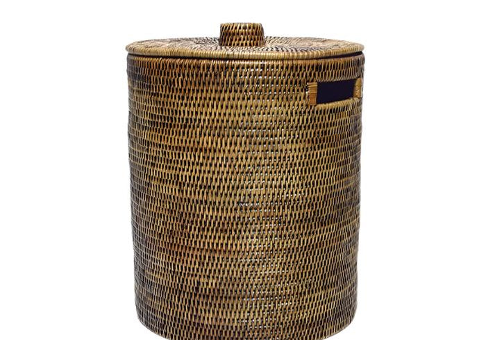 Handwoven Luxe Washing Hamper, a tall round woven basket with a lid and a cut-out side handle, on white