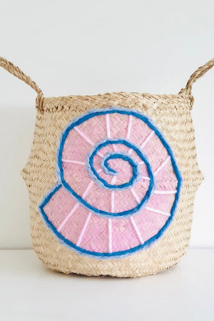 Shell belly basket, large, front view with a pink and blue woollen spiral shell design and two woven handles