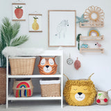 Vivid Rainbow Belly Basket on the bottom shelf of a white changing unit, beside animal baskets and wall art