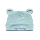 A light blue baby beanie hat with two small bear ears on top and the embroidered text 'Hey ladies' on the front cuff, shown against a plain white background.