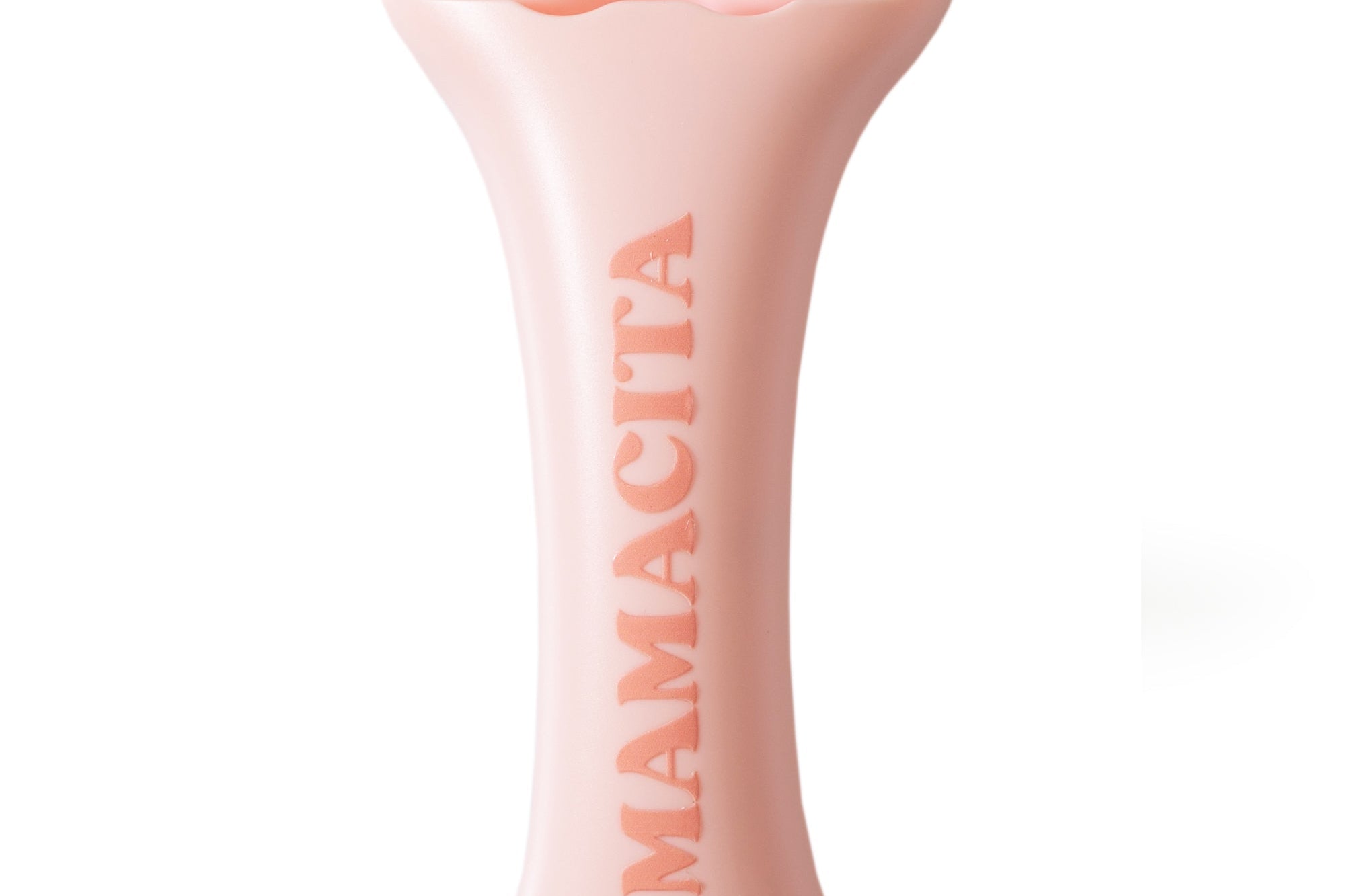 A light pink bone-shaped personal massager by MAMACITA, featuring two rounded balls at the top and the brand name embossed vertically on the handle, set against a plain white background.