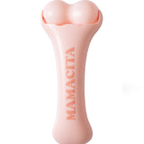 A light pink bone-shaped personal massager by MAMACITA, featuring two rounded balls at the top and the brand name embossed vertically on the handle, set against a plain white background.
