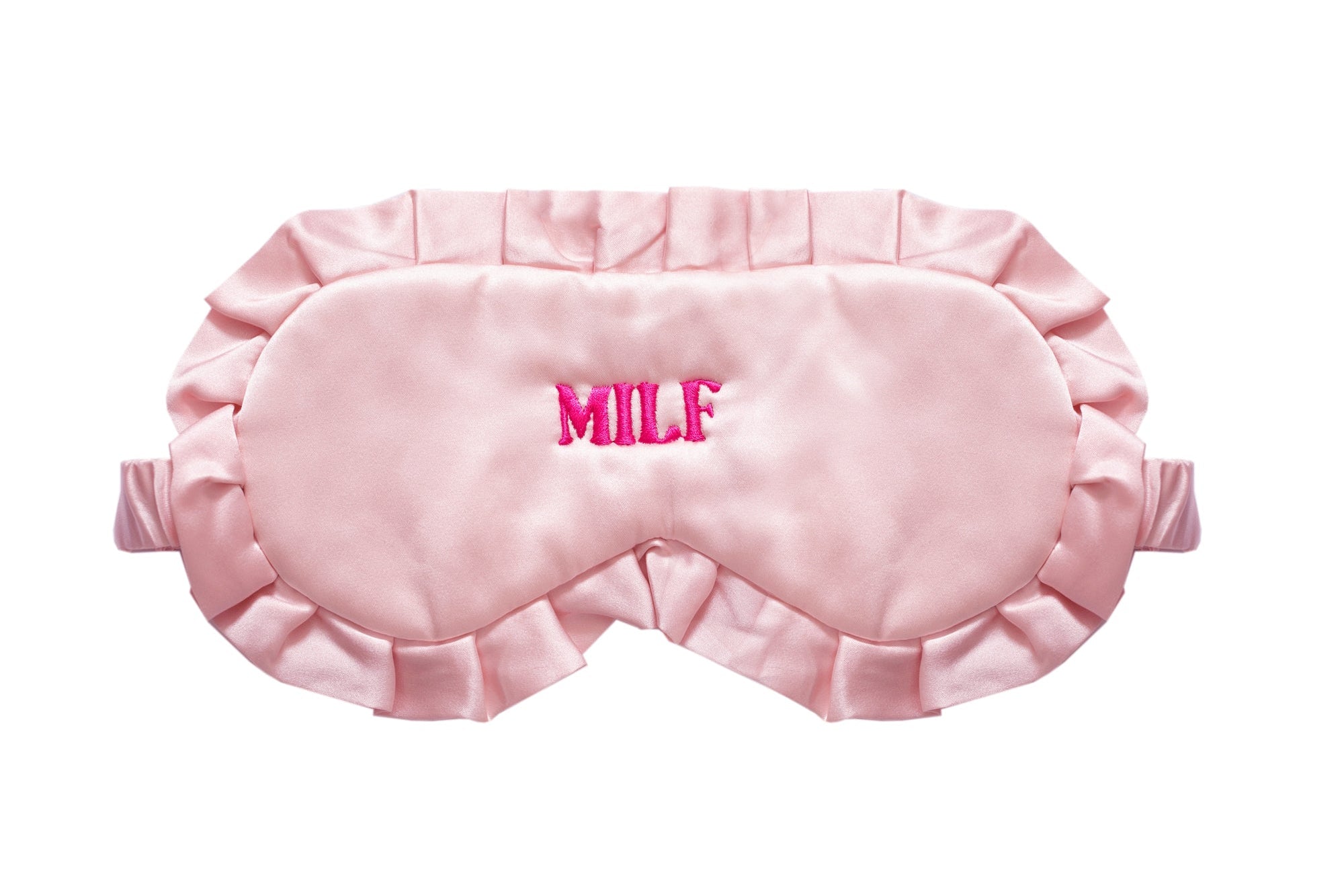 A light pink satin sleep mask with ruffled edges and the word 'MILF' embroidered in bright pink on the forehead, shown against a plain white background.