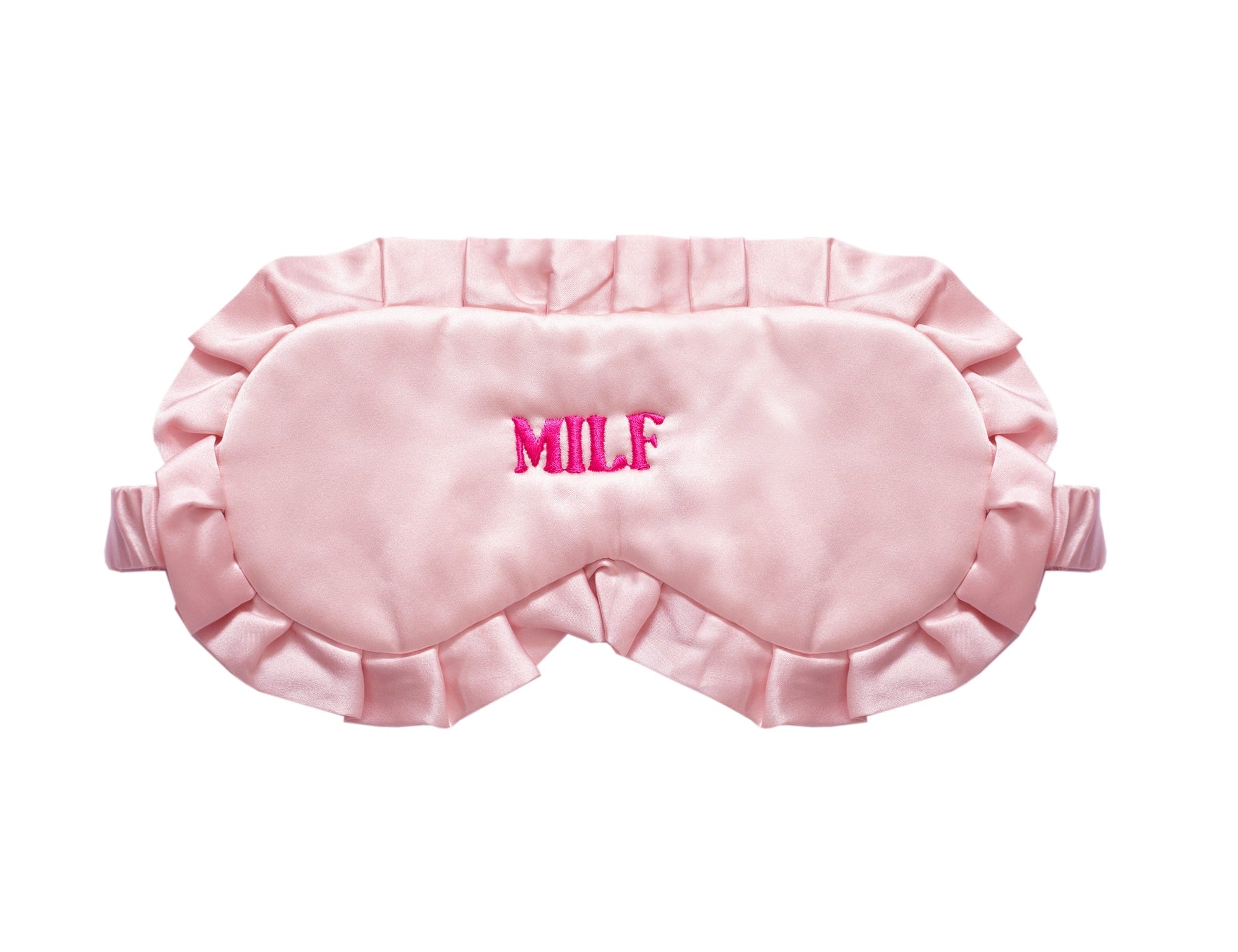 A light pink satin sleep mask with ruffled edges and the word 'MILF' embroidered in bright pink on the forehead, shown against a plain white background.