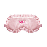 A light pink satin sleep mask with ruffled edges and the word 'MILF' embroidered in bright pink on the forehead, shown against a plain white background.
