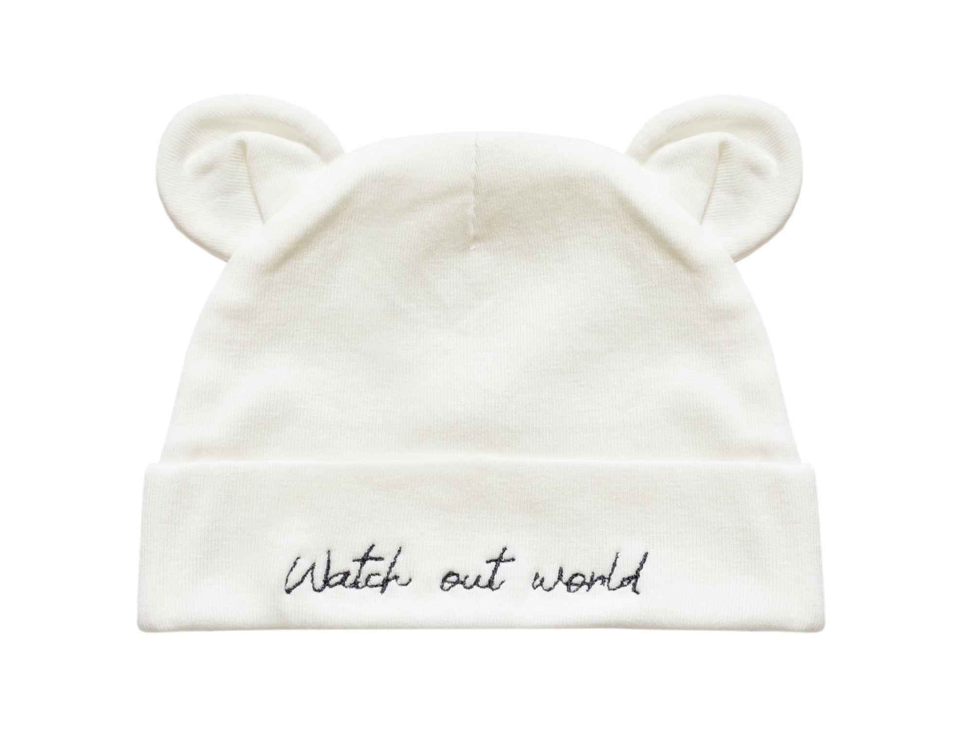 An off-white knit baby beanie hat featuring embroidered bear ears on top and the phrase 'Watch out world' in black script on the folded cuff.