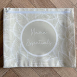 Hospital bag organiser pouches, beige leaf, flat pouch labelled Mama Essentials on a wooden floor