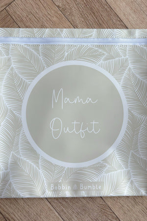 Hospital bag organiser pouches, beige leaf, flat pouch labelled Mama Outfit on a wooden floor
