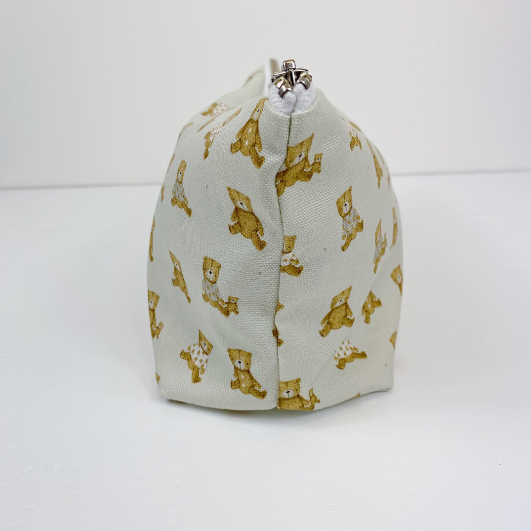 Teddy Bear Print nappy wallet, side view showing the seam, silver zip end and teddy bear pattern