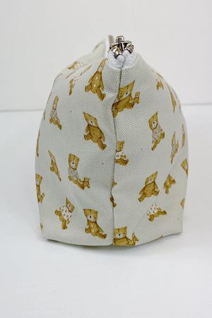 Teddy Bear Print nappy wallet, side view showing the seam, silver zip end and teddy bear pattern
