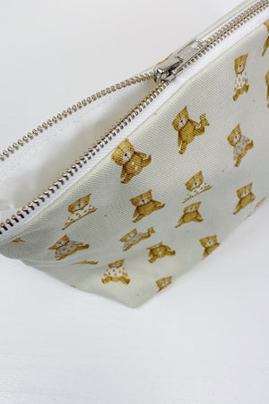 Teddy Bear Print nappy wallet, zip partly open showing the white lining inside the pouch