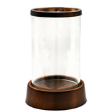 Palm Beach Hurricane Lantern with a clear glass cylinder and a copper-toned base and rim, on white