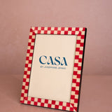Classic Red Checked Photo Frame 7x5 at an angle, with a red and cream checked border and a Casa by Josephine Jenno card