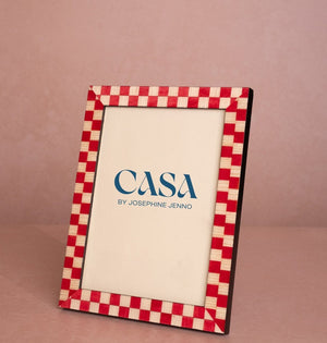 Classic Red Checked Photo Frame 7x5 at an angle, with a red and cream checked border and a Casa by Josephine Jenno card