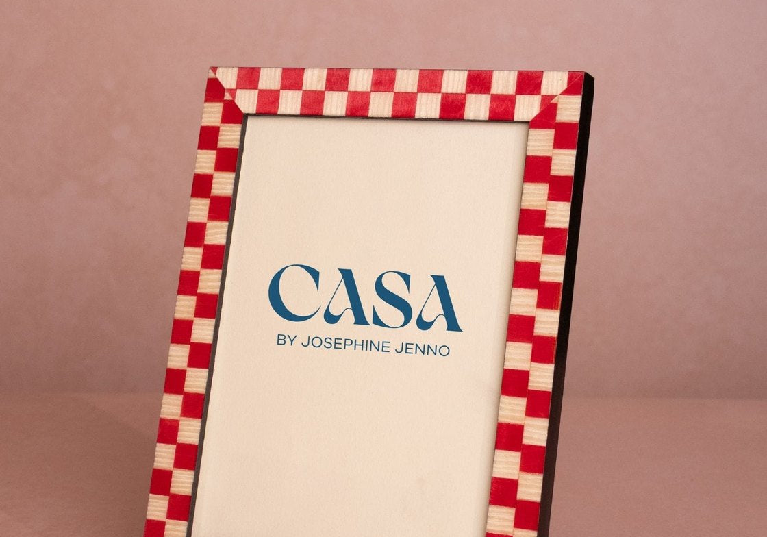 Classic Red Checked Photo Frame 7x5 at an angle, with a red and cream checked border and a Casa by Josephine Jenno card