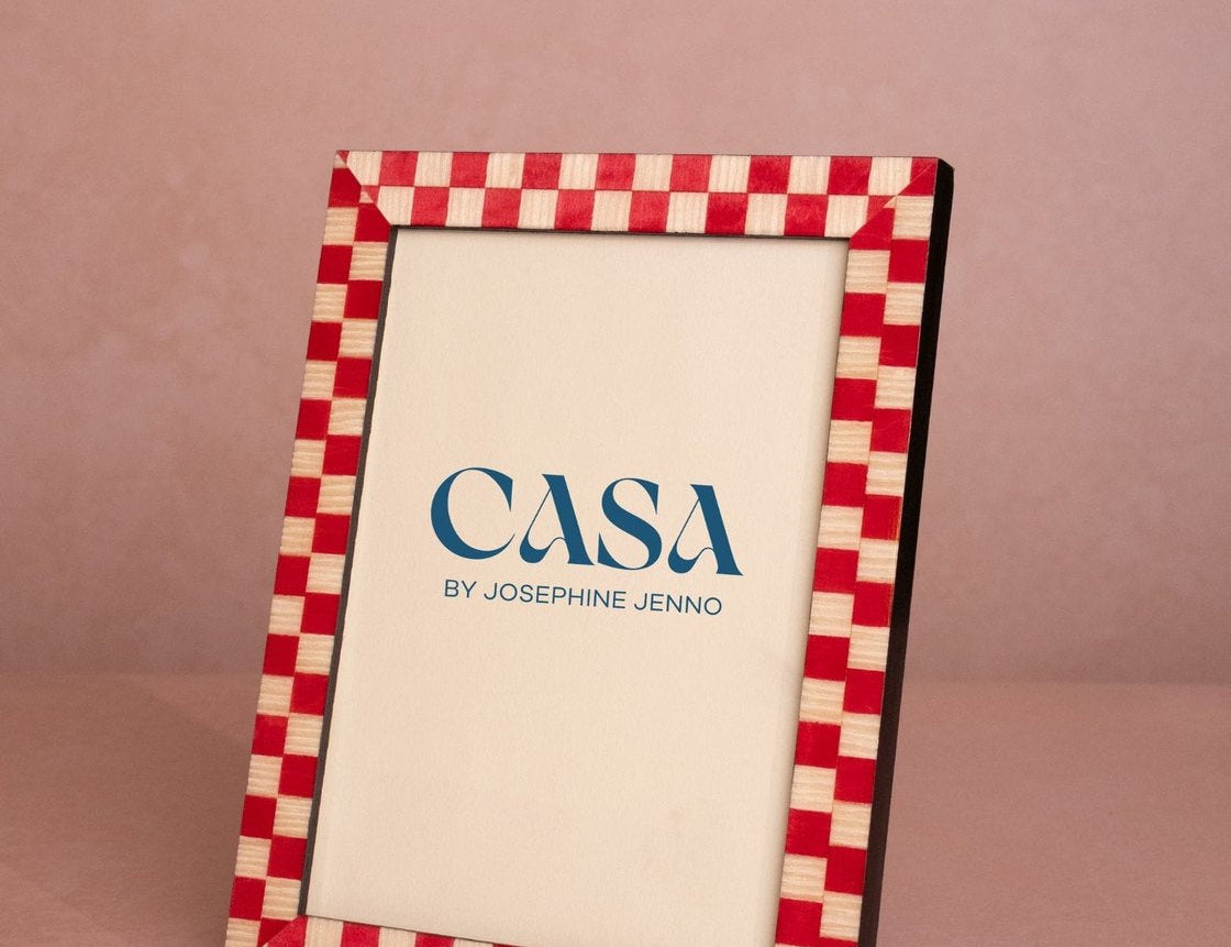 Classic Red Checked Photo Frame 7x5 at an angle, with a red and cream checked border and a Casa by Josephine Jenno card